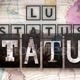 LU_STATUS_OFICIAL